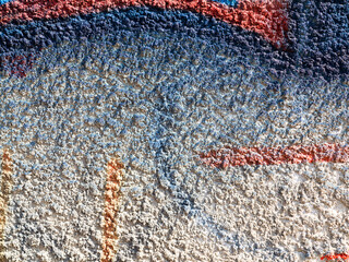 Landscape style. Grungy concrete surface with cracks, scratches traces of different colors paint on...