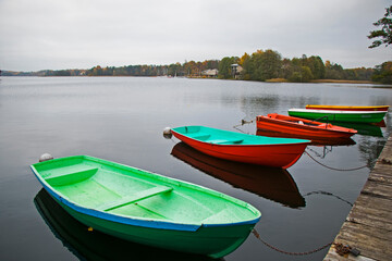 Fototapeta na wymiar Old wooden boats near the beach of Trakai Gavle lake l, Lithuania