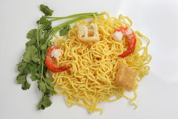 Fresh yellow egg noodle prawn tofu coriander leaf on whit background