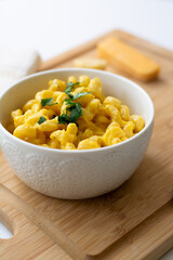 Traditional American macaroni and cheese comfort food (also called mac n cheese) with elbow pasta...