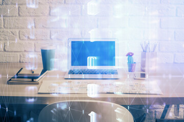 Double exposure of desktop computer and technology theme hologram. Concept of software development.