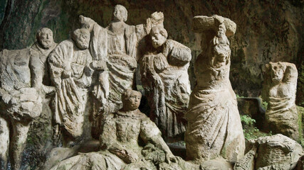 Obraz premium Group of Christian faithful statues excavated in the rock of Piedigrotta of Pizzo Calabro