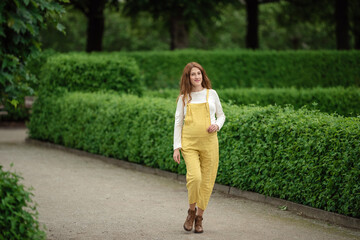 Beautiful pregnant girl walking in the Park.