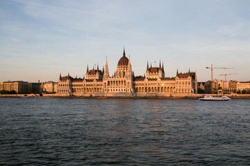 Fototapeta na wymiar Budapest parliament building at sunset golden time with blue and Danube river