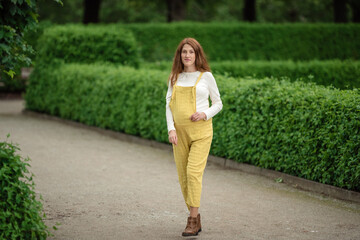 Beautiful pregnant girl walking in the Park.