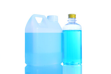 Blue alcohol bottle with gold color cap, alcohol gel 70 in white plastic, gallon, and pump bottle on a white background.Concept anti-virus COVID-19 or protection coronavirus.