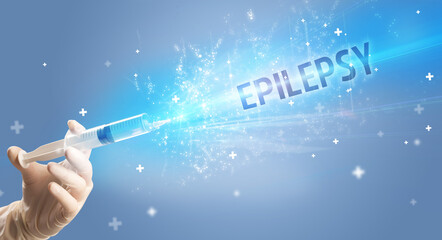 Syringe, medical injection in hand with EPILEPSY inscription, medical antidote concept