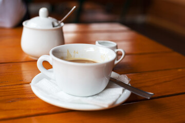 Cup of coffee. Morning atmospheric lighting, fashionable trendy spot soft focus. Preparation for design creative menu.