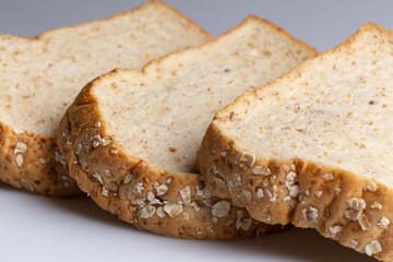 Whole wheat bread isolated on white background. Slice bread, made from 12 kinds of grains, clearly portray the texture and look delicious.