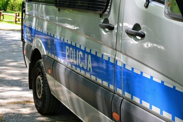 Close-up view of police car with POLICJA sign (translation: POLICE). Police car on the street