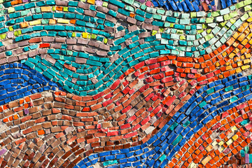 Diagonal colorful mosaic texture on the wall