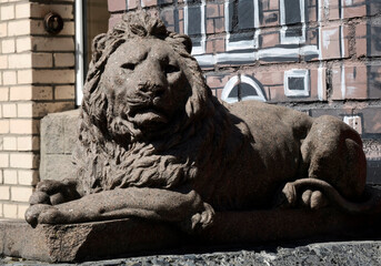 Lion statue. Stone monument. Medieval architecture. Historical heritage.