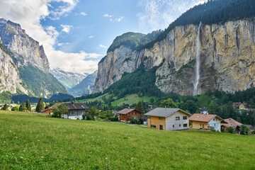 Fototapeta na wymiar Landscape panorama of Lauterbrunnen Valley with its famous waterfall and green nature, Switzerland