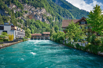 Naklejka premium Panorama of Interlaken with river and wooden bridge, Switzerland