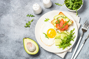 Healthy breakfast with egg, toast and salad.