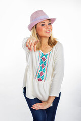 Young smiling woman in a summer hat isolated on white.