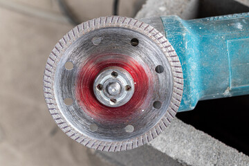 Small grinder with disc for cutting ceramics tiles construction tile cutter. - Concept industry.