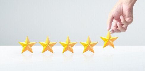 Hand of touching rise on increasing five stars. Increase rating evaluation classification concept