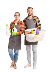 Couple with laundry on white background
