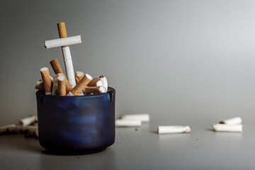 Stack of cigarette like graves.Cigarettes is addictive to be cancer.smoking reduction campaign in World No Tobacco Day.
