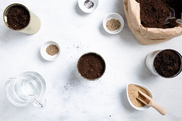 Planting seeds for home garden. Reuse of tin to grow plants. Zero waste, recycle, upcycle. Top view