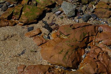 The beach has a natural crack rocks.