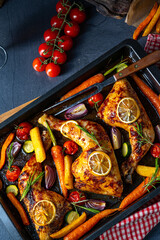 Grilled chicken legs with various vegetables and herbs.