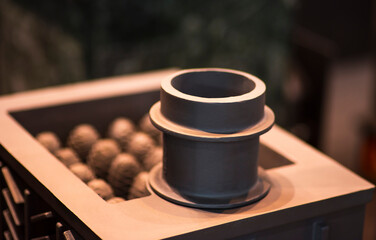 A new cast iron wood stove burning hot with slate tile.