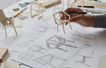 Designer sketching drawing design development product plan draft chair armchair Wingback Interior...