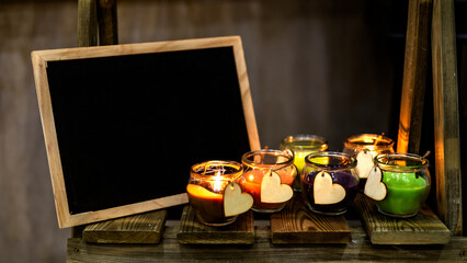 candles with heart figures with slate for text