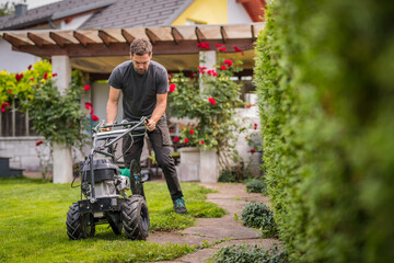 Cable laying machine with an operator used to put down cables for robotic lawnmowers. Inserting...