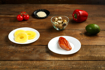 Ingredients for a pan-Asian salad are smoked chicken, pineapple, quail eggs, tomatoes and sesame.
