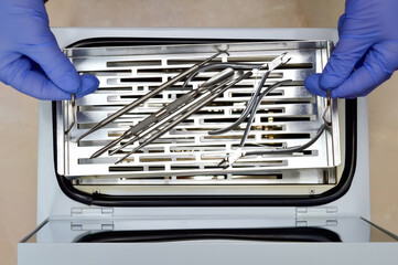 top view of manicure and pedicure tools after steam sterilization iin autoclave, disinfecting from...
