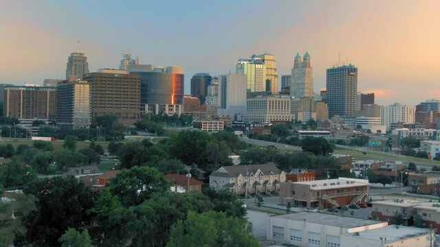 Aerial flying to downtown Kansas City at sunset. Missouri, USA