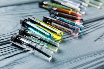 Perfume samples on wooden background