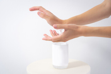 Hand of lady cleaning hands with alcohol gel or anti bacteria soap to stop germ, bacteria, virus. Covid19 coronavirus prevention
