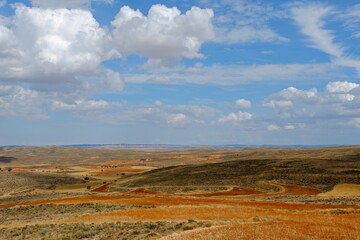 Beautiful steppe landscape. Volumetric cloudscape, blue sky. Teruel Province, Aragon, Spain