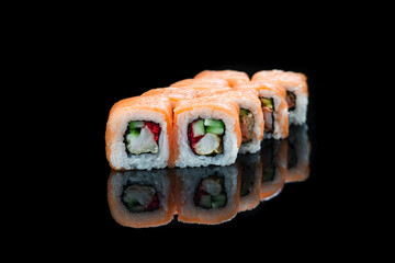 Sushi Roll On A Black Background reflection . Japanese food. Close Up.
