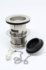Bath sink plughole set and rubber plug with chain on white background.
