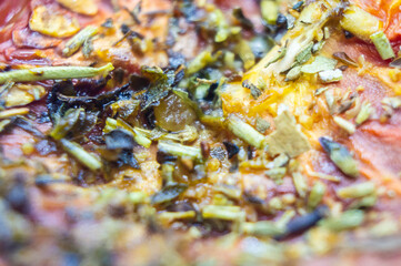 Sun-dried Italian tomatoes with seasoning closeup. Macro photography