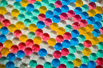 Fototapeta na wymiar Water colourful gel balls. Texture of multicoloured hydrogel balls for background.