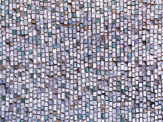 Old diagonal colorful mosaic texture on the wall. Landscape style. Great background or texture.