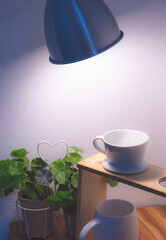 White drip coffee maker on wood table
