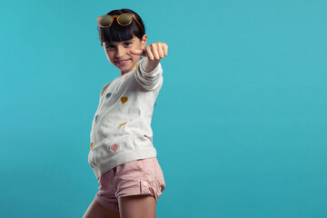 portrait of a cute smiling girl on a blue background