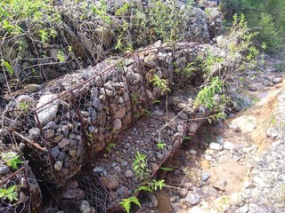 Broken gabions near the road