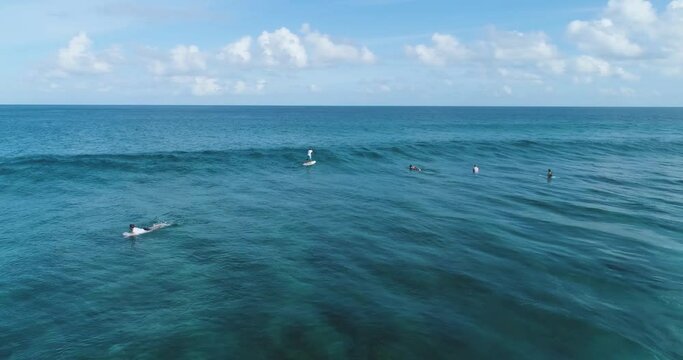 Flying at low altitude above the ocean lifestyle activity. Aerial drone shot over clear sea ocean blue water