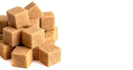 Steps made of dark sugar cubes on a white isolated background, free space