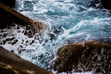 blue water wave splash on the rocks