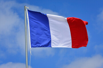 Naklejka na ściany i meble France flag in the wind on the top of the mast
