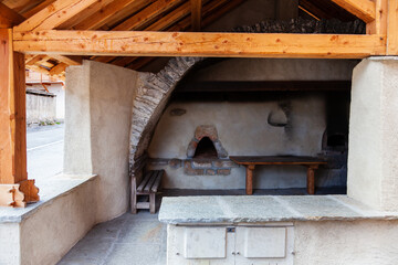 Fototapeta na wymiar Traditional village oven for bread baking. Outdoor public communal stove. France, Europe.